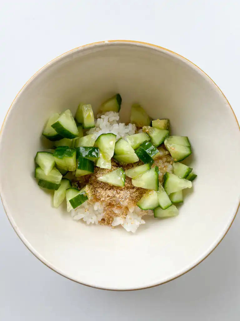 Warm cooked short-grain white rice placed in a bowl.