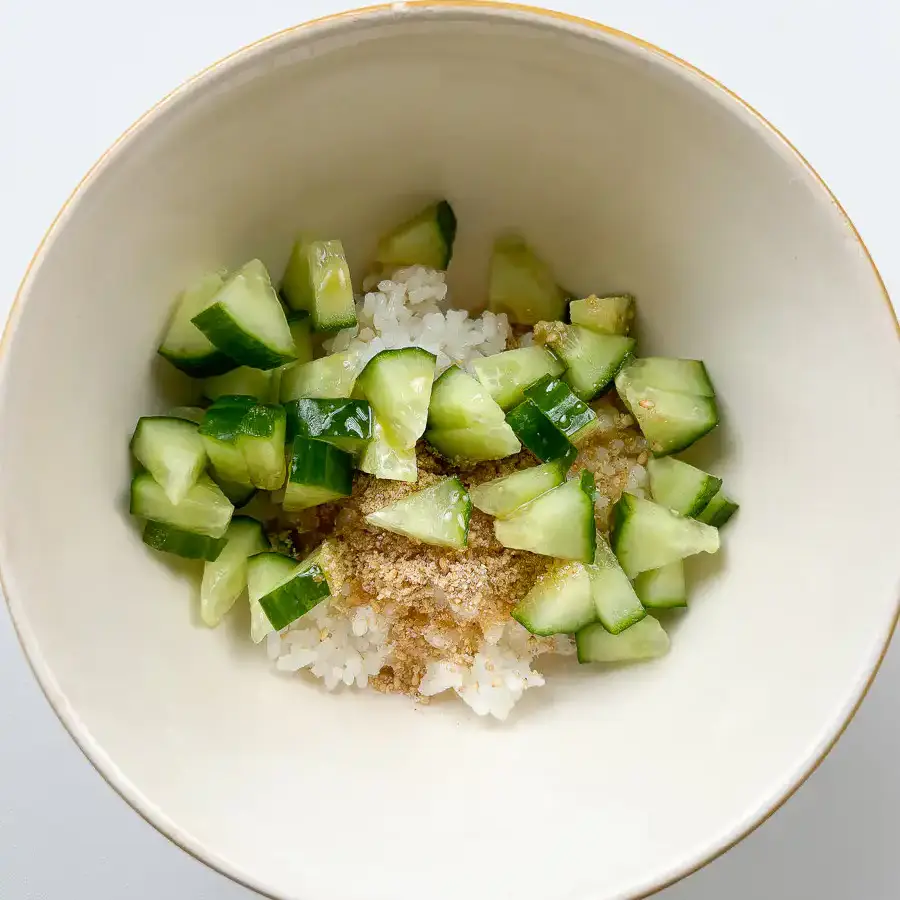 Warm cooked short-grain white rice placed in a bowl.