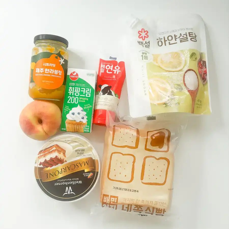 Earl Grey Peach Sando: Korean Cafe Fruit Sandwich Ingredients for a peach sando including white bread, heavy cream, mascarpone, peach, and earl grey tea bag.