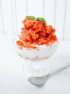 Tomato Bingsu: Easy Bingsu Recipe with Greek Yogurt Fluffy white yogurt ice peeking through layers of red tomato bingsu purée.
