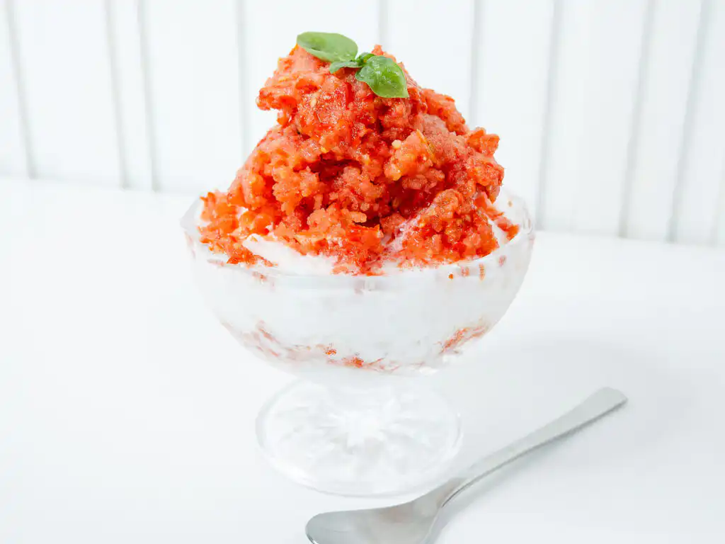 Tomato Bingsu: Easy Bingsu Recipe with Greek Yogurt right outdoor natural sunlight illuminating a bowl of frozen tomato bingsu.