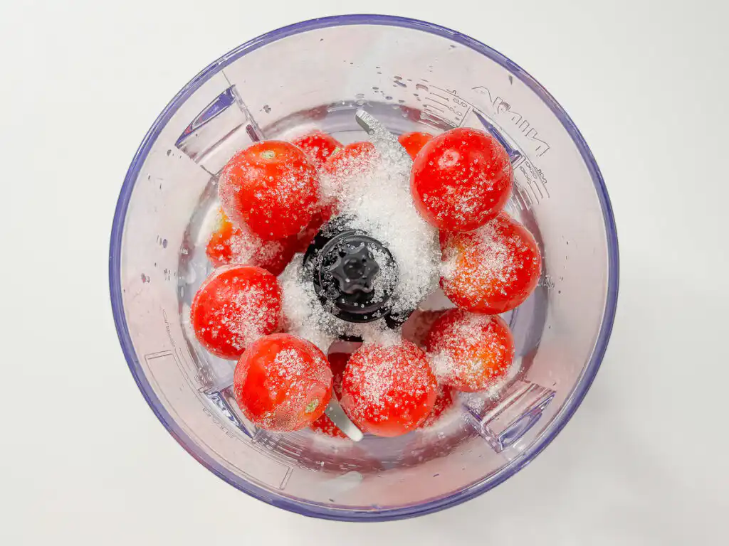 Tomato Bingsu: Easy Bingsu Recipe with Greek Yogurt Pouring sugar and lemon juice over frozen tomatoes in the blender.