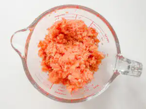 Tomato Bingsu: Easy Bingsu Recipe with Greek Yogurt Pouring sugar and lemon juice over frozen tomatoes in the blender.
