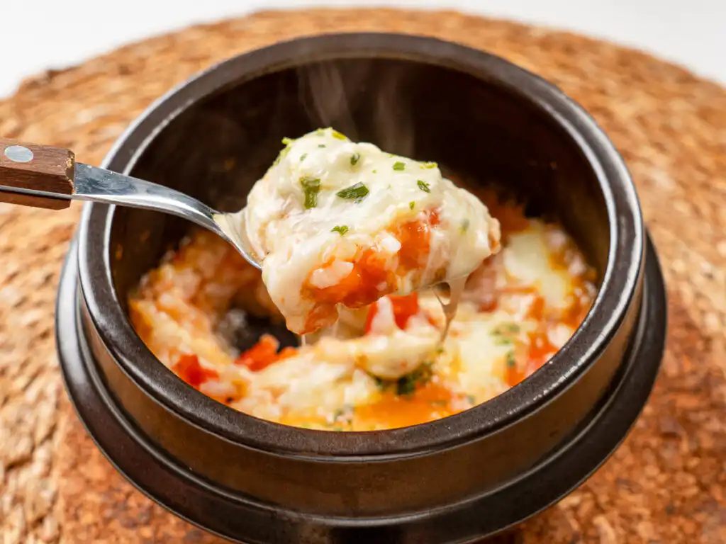 e gooey mozzarella cheese pull makes this tomato rice recipe irresistible.