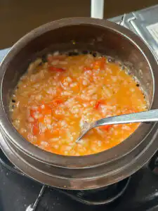 Tomato Rice Recipe: 10 Min Easy Cheesy Korean Pot Rice : Stirring mashed cherry tomatoes and butter thoroughly into cooked white rice.