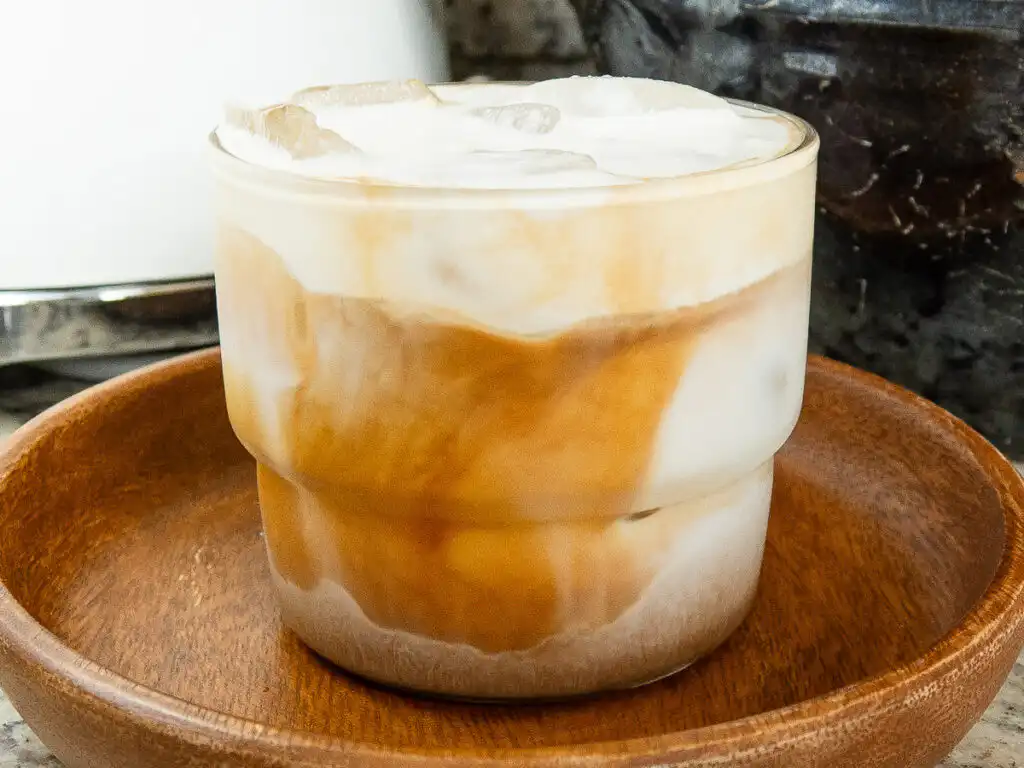 Viral Korean Barley Tea Latte: Easy Boricha Latte in 5 min Close-up view of condensation on a tall barley tea latte glass.