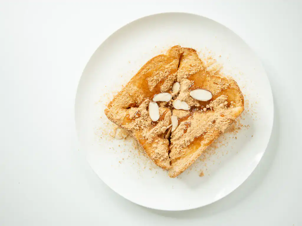 5 Min Injeolmi Toast: Easy Sulbing Toast with Korean Rice cake Melted stretchy injeolmi rice cake pulling out from crispy toasted buttered bread slices of injeolmi toast.