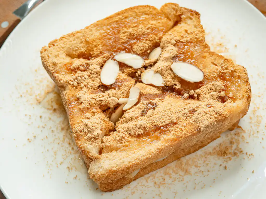 5 Min Injeolmi Toast: Easy Sulbing Toast with Korean Rice cake Perfectly cooked sulbing toast style snack topped with honey drizzle and toasted nuts.