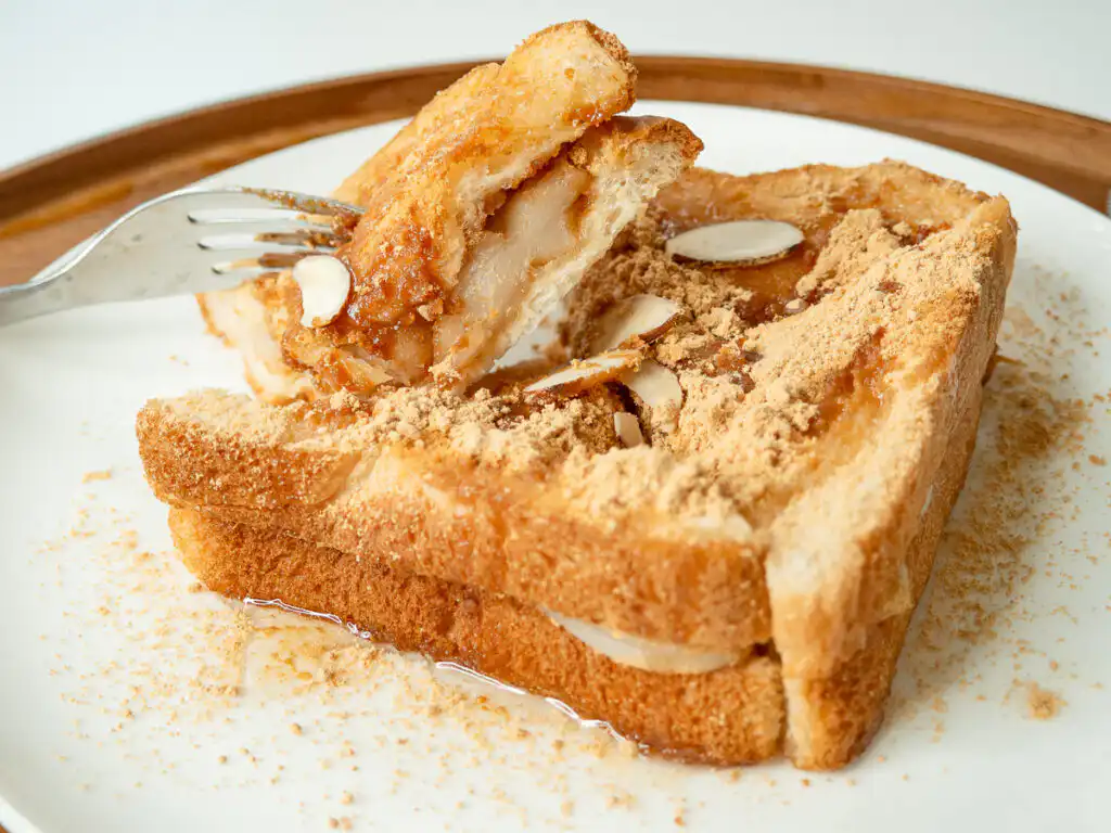 5 Min Injeolmi Toast: Easy Sulbing Toast with Korean Rice cake Side profile showing the thick stretchy rice cake layer inside an injeolmi toast slice.