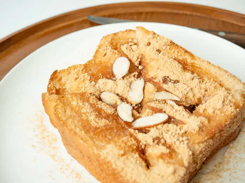5 Min Injeolmi Toast: Easy Sulbing Toast with Korean Rice cake Close up view of crispy bread edges and melted rice cake inside an injeolmi toast.