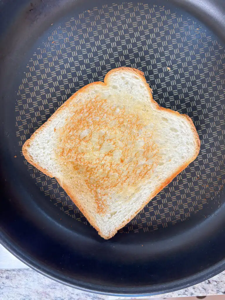 Toast milk bread slices in butter: injeolmi toast recipe