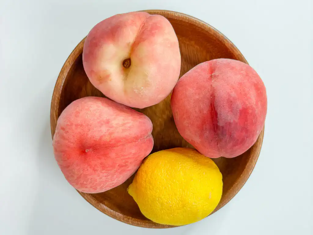 Korean Peach Syrup (Peach Cheong Recipe) for Peach Ade Wash peaches and a lemon for Korean peach syrup