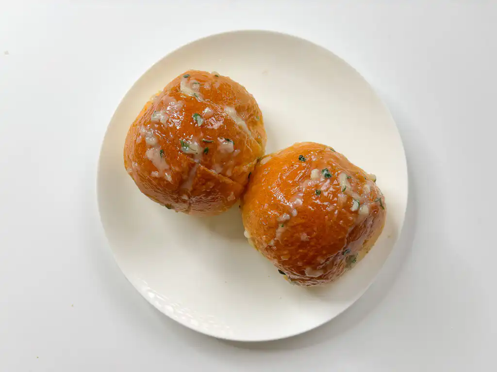 Korean Sweet Garlic Bread with Dinner Rolls: No Cream Cheese, Air Fryer Spreading sauce over the top of Korean garlic bread before air frying