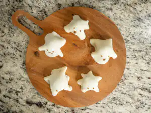 Halloween Ghost Mochi with Shine Muscat, 15-Min Microwave Overhead view of Halloween ghost mochi on a wooden plate