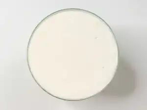 10Min Shine Muscat Cake: Korean Cream Cake with Grape Leveling top cream surface with a scraper tool for Korean cream cake
