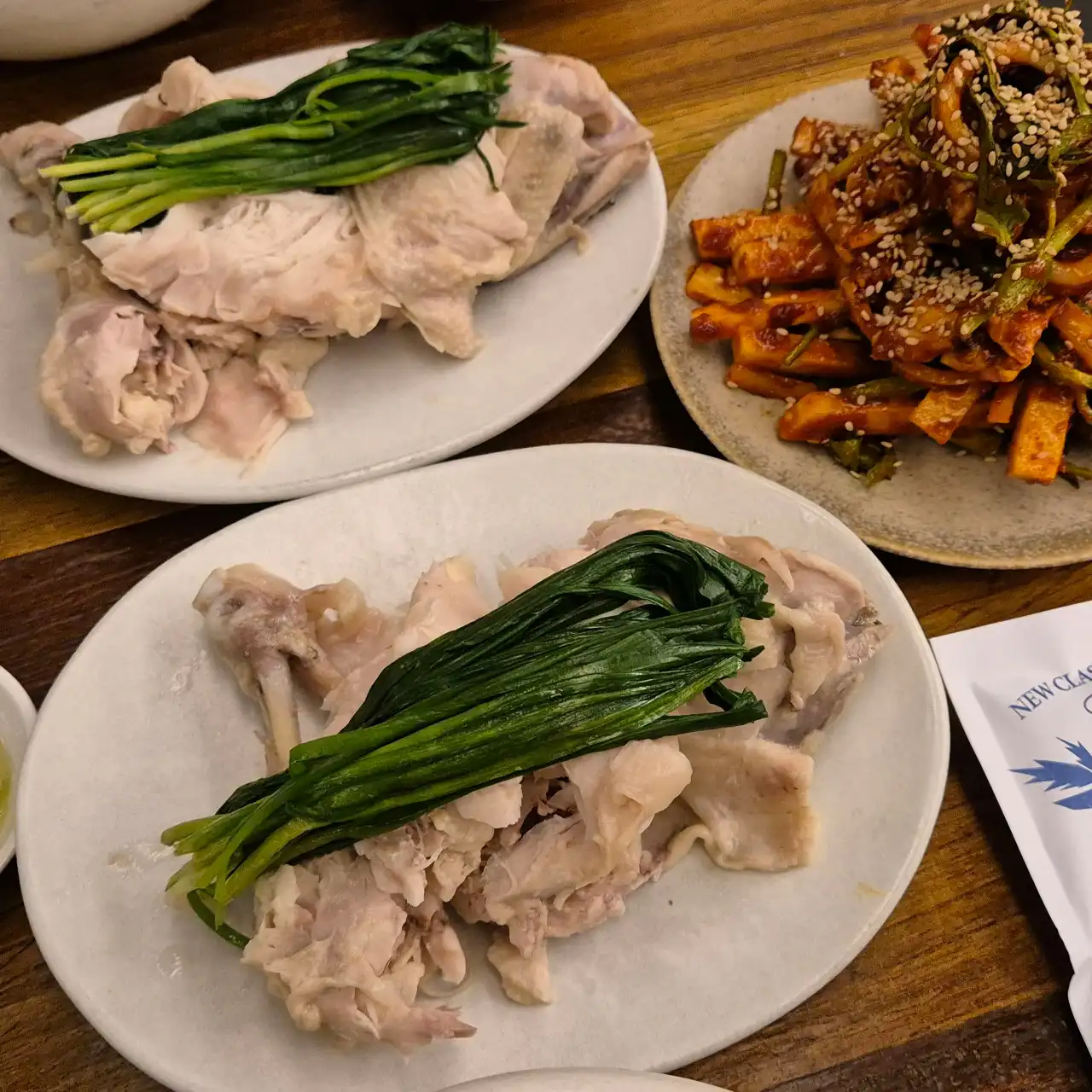 Justin Bieber Seoul Hotspots: 10 Places He Visited in Korea Boiled chicken topped with garlic chives at Muguok, a Justin Bieber Seoul restaurant in Anguk