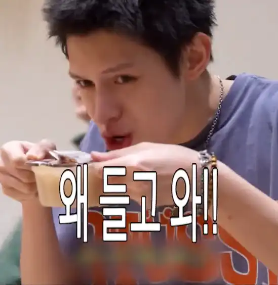 James drinks the fish cake broth while walking around.