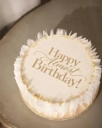 Justin Bieber Seoul Hotspots: 10 Places He Visited in Korea White and gold “Happy Almost Birthday!” cake from The Oh’s Room, made for Hailey Bieber during Justin Bieber’s Seoul visit