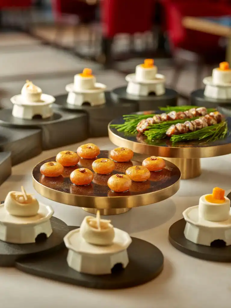 Justin Bieber Seoul Hotspots: 10 Places He Visited in Korea Korean-style desserts on brass stands at the CONSTANS buffet, a Justin Bieber Seoul breakfast spot